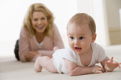 baby and mother crawling on clean carpet